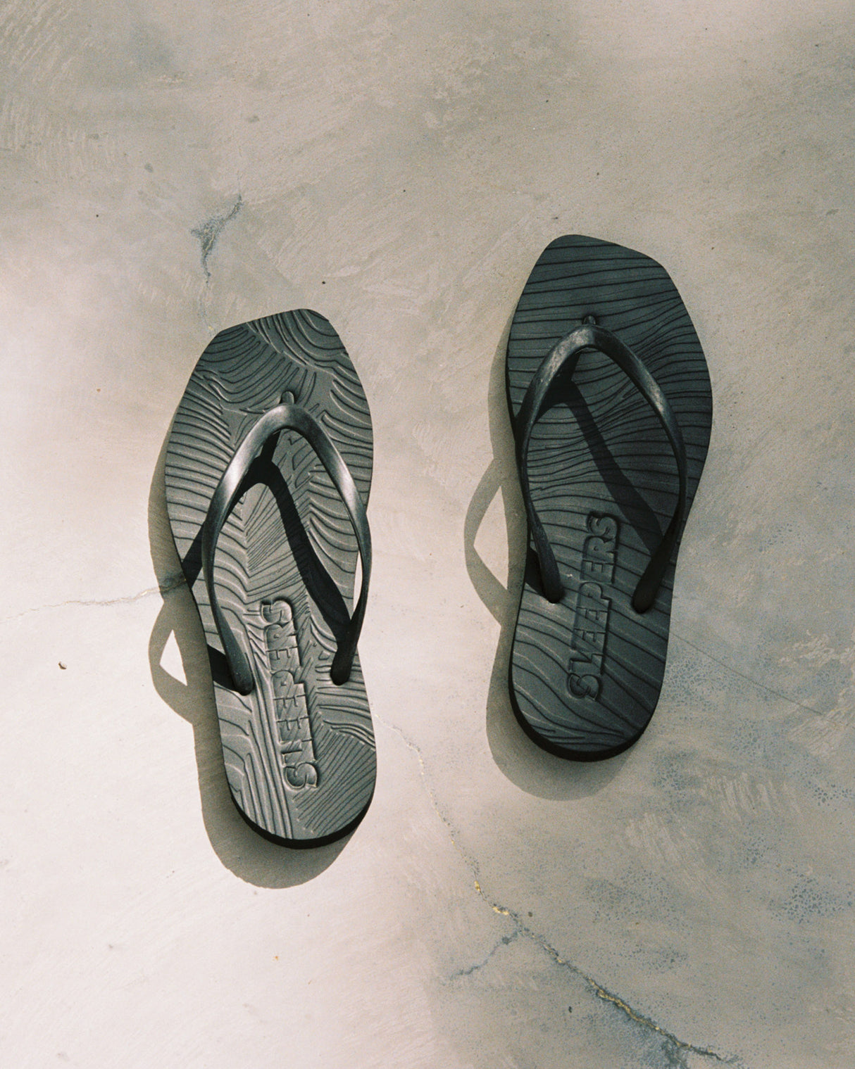 Black Sleepers Flip Flops